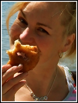 Sarah eating a sugar doughnut