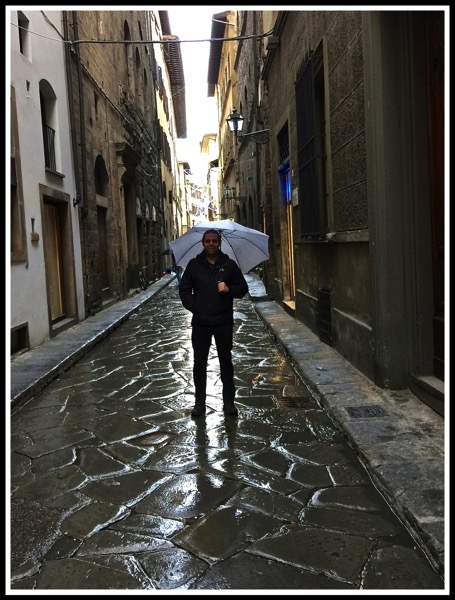 Me with umbrella in narrow streets