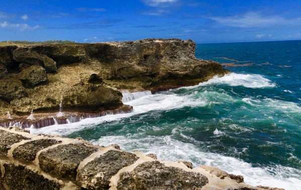 Waves crashing against the rocky coastline at North Point, Barbados
